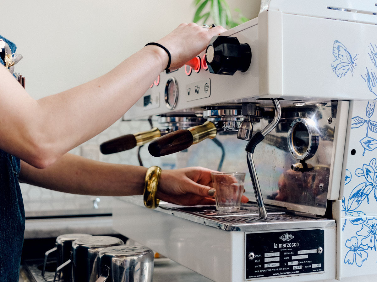 Barista pulling a shot of espresso